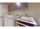 Well-equipped laundry room featuring a washing machine, dryer, and a deep sink at 1891 Curtis St # 1613, Denver, CO 80202