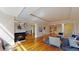 Spacious living room featuring a cozy fireplace and hardwood floors throughout the home at 1891 Curtis St # 1613, Denver, CO 80202