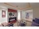 Elegant living room with unique film decor, hardwood floors and a modern aesthetic at 1891 Curtis St # 1613, Denver, CO 80202