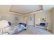 Serene main bedroom offers a bed, bench, and soft, neutral colors at 1891 Curtis St # 1613, Denver, CO 80202