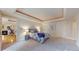 Expansive main bedroom featuring tray ceilings with ambient lighting and an attached sitting room with fireplace at 1891 Curtis St # 1613, Denver, CO 80202
