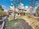 Spacious backyard featuring a wooden deck, lawn, and mature trees creating a private outdoor space at 3790 E Geddes Ave, Centennial, CO 80122