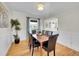 Inviting dining room with hardwood floors, wainscoting, and natural light at 3790 E Geddes Ave, Centennial, CO 80122