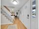 Bright foyer with hardwood floors, staircase, and access to the dining area creating an open and welcoming entrance at 3790 E Geddes Ave, Centennial, CO 80122