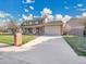 Charming two-story home with brick accents, inviting front porch, long driveway, and manicured lawn at 3790 E Geddes Ave, Centennial, CO 80122