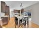 Spacious kitchen with a large granite island, modern appliances, and hardwood floors, perfect for cooking and entertaining at 3790 E Geddes Ave, Centennial, CO 80122