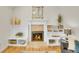 Cozy living room with a fireplace, built-in shelving, and natural light at 3790 E Geddes Ave, Centennial, CO 80122