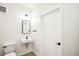 Modern bathroom with a stylish mirror, toilet, and sink, offering a clean and functional design at 5375 W 14Th Ave, Lakewood, CO 80214