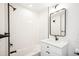 Stylish bathroom features modern fixtures, a sleek vanity, and a shower over tub with vertical white tiling at 5375 W 14Th Ave, Lakewood, CO 80214