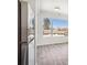 Bedroom featuring luxury vinyl flooring, white trim, and a view to the exterior at 5375 W 14Th Ave, Lakewood, CO 80214