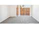 Bright bedroom featuring a large window with natural light and neutral carpet flooring at 5375 W 14Th Ave, Lakewood, CO 80214