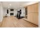 Finished basement with gym including sauna, treadmill, and fireplace; a perfect workout space at home at 15 South Ln, Cherry Hills Village, CO 80113