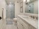 Elegant bathroom featuring marble finishes, a glass-enclosed shower, and modern fixtures at 15 South Ln, Cherry Hills Village, CO 80113
