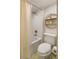 Bright bathroom features stylish tile, tub and shower, and a modern circular shelf with curated decorations at 15 South Ln, Cherry Hills Village, CO 80113
