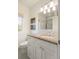 Bright bathroom with a granite vanity, a large mirror, and a tiled shower for a luxurious feel at 15 South Ln, Cherry Hills Village, CO 80113