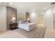 Spacious bedroom with a large bed, neutral colors, and an ensuite bathroom with a soaking tub at 15 South Ln, Cherry Hills Village, CO 80113