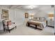 Calm bedroom with a neutral color palette, stylish decor, and a comfortable reading nook at 15 South Ln, Cherry Hills Village, CO 80113