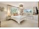 Charming bedroom with a window seat, built-ins, and neutral color palette at 15 South Ln, Cherry Hills Village, CO 80113