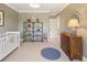 Bedroom features stylish wallpaper, built in storage, and room for a crib and changing table at 15 South Ln, Cherry Hills Village, CO 80113