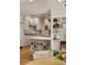 Well-appointed kitchen features white cabinets, marble countertops, a center island, and stainless appliances at 15 South Ln, Cherry Hills Village, CO 80113