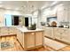 Bright kitchen featuring custom cabinets, a central island, and modern appliances at 15 South Ln, Cherry Hills Village, CO 80113