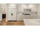 Well-equipped kitchen featuring marble countertops, stainless steel appliances, and ample storage at 15 South Ln, Cherry Hills Village, CO 80113