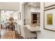 Bright kitchen showcasing a marble island with bar seating and gold fixtures, perfect for entertaining at 15 South Ln, Cherry Hills Village, CO 80113