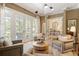 Elegant living room with multiple chairs, french doors, and a decorative chandelier at 15 South Ln, Cherry Hills Village, CO 80113
