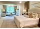 Spacious main bedroom with a sitting area, large windows, and stylish decor at 15 South Ln, Cherry Hills Village, CO 80113