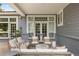 Covered patio features comfortable seating and elegant decor, perfect for relaxation and outdoor gatherings at 15 South Ln, Cherry Hills Village, CO 80113