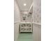 Charming powder room with wainscoting, decorative wallpaper, decorative mirror and lovely decor at 15 South Ln, Cherry Hills Village, CO 80113