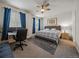 Spacious bedroom with large bed, workspace, and ample natural light at 15476 W 64Th Loop # C, Arvada, CO 80007