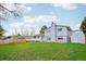 View of the house and its backyard featuring a well-kept lawn at 9435 Osceola St, Westminster, CO 80031