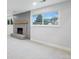 Cozy finished basement with a brick fireplace, offering a warm and inviting space at 9435 Osceola St, Westminster, CO 80031