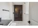 Modern bathroom featuring white tile, black shower tile accent wall, and sleek fixtures at 9435 Osceola St, Westminster, CO 80031