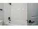 Modern bathroom features a bathtub with black hardware and subway tile at 9435 Osceola St, Westminster, CO 80031