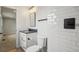 Stylish bathroom with white vanity, sleek mirror, and walk in access to an adjacent room at 9435 Osceola St, Westminster, CO 80031