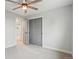 Bright bedroom features soft carpet, fan, and a double-door closet at 9435 Osceola St, Westminster, CO 80031