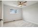Neutral bedroom with a fan, carpeted floor, window, and white trim at 9435 Osceola St, Westminster, CO 80031
