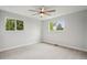 Neutral bedroom boasts plush carpet, large windows and bright paint at 9435 Osceola St, Westminster, CO 80031