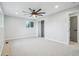 Spacious bedroom with a ceiling fan, large closet, and neutral carpet at 9435 Osceola St, Westminster, CO 80031