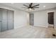 Spacious bedroom with a ceiling fan and large closet with doors at 9435 Osceola St, Westminster, CO 80031