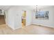 Modern dining room with a stylish light fixture and large windows providing natural light at 9435 Osceola St, Westminster, CO 80031