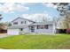 Attractive two-story home with lush green lawn, fresh exterior paint, and black accent shutters at 9435 Osceola St, Westminster, CO 80031