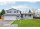 Charming two-story home featuring a well-manicured lawn and attached two-car garage, perfect for Gathering living at 9435 Osceola St, Westminster, CO 80031