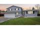 Charming two-story home with a well-maintained lawn and an attached two-car garage at 9435 Osceola St, Westminster, CO 80031