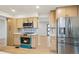 Bright kitchen with stainless steel appliances, modern cabinetry and a beautiful backsplash design at 9435 Osceola St, Westminster, CO 80031