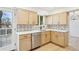 Well-lit kitchen features modern cabinetry, stainless steel appliances, and tiled backsplash at 9435 Osceola St, Westminster, CO 80031