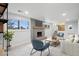 Comfortable living room showcasing fireplace and open access to the staircase at 9435 Osceola St, Westminster, CO 80031