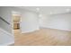 Bright living room featuring light wood floors and neutral paint, adjacent to the kitchen at 9435 Osceola St, Westminster, CO 80031